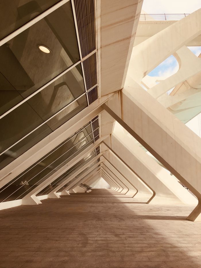 services-03 Futuristic architectural arches with glass reflections in València, Spain. Captivating modern design.